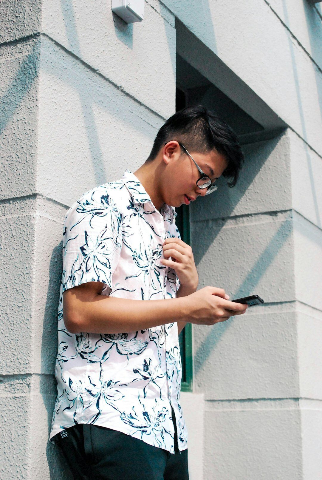 Mexican insurance advisor reviewing policies on a tablet in a modern office