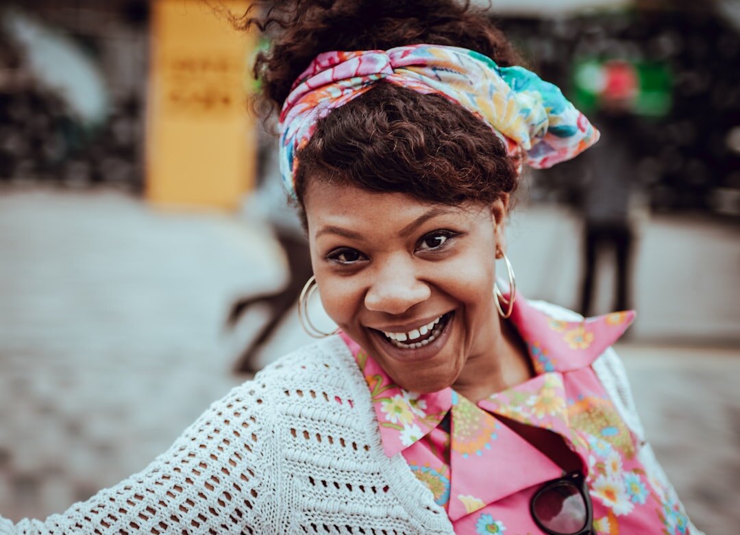 Friendly Mexican customer support agent smiling at desk
